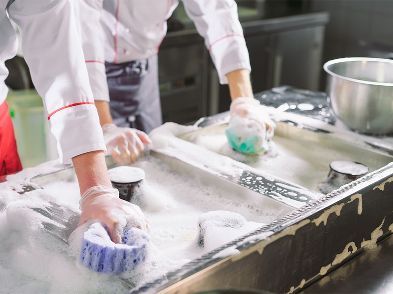 Kitchen staff using reliable amphoteric surfactants manufactured by Lakeland Labs.